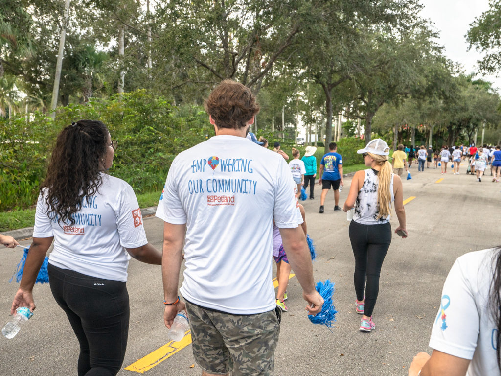 Petland team members walking to support autism awareness at Autism Walk.