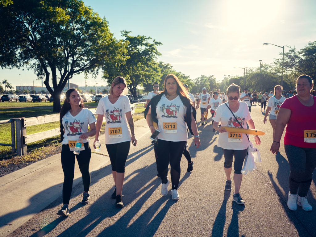 4 Petland Pembroke Pines team members smiling at camera and walking at St. Jude Walk