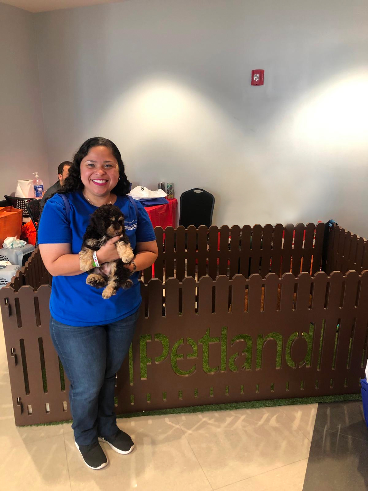 Petland Pembroke Pines picture of Veterans Outreach Day participant holding a cute Petland puppy.