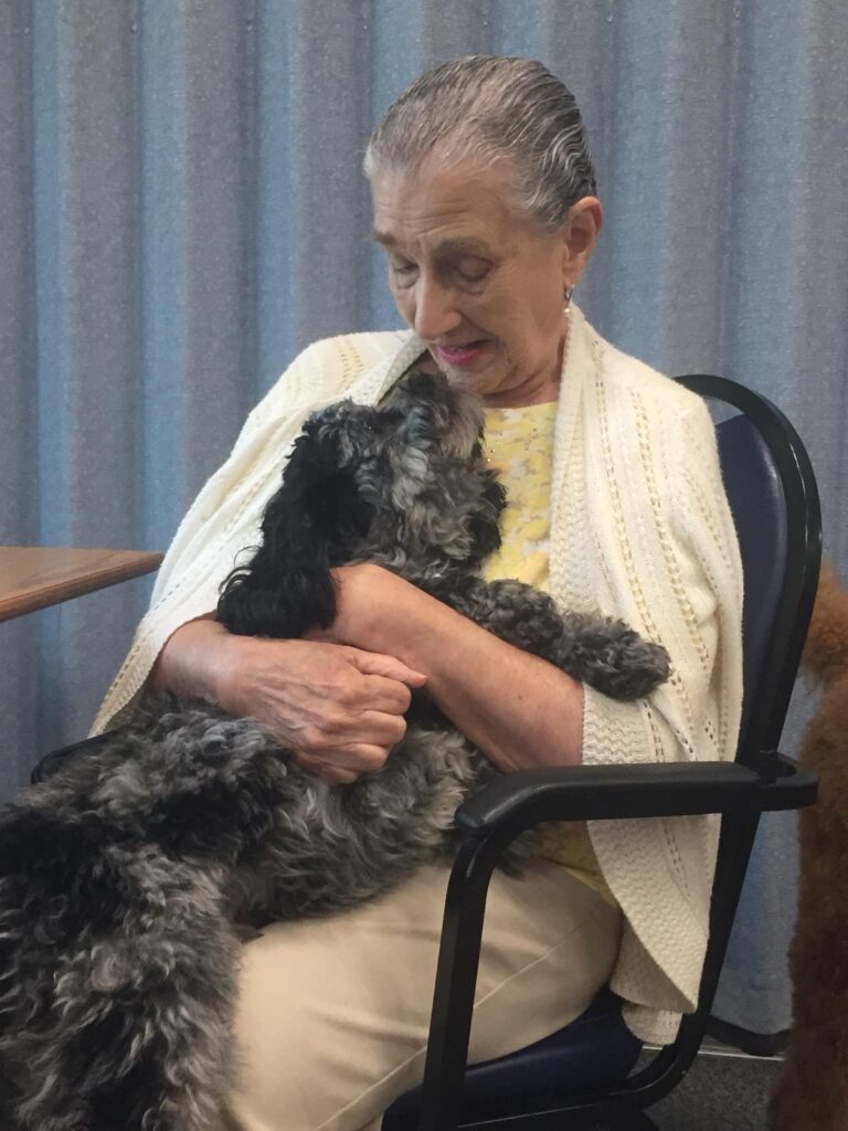 Petland Pembroke Pines picture of Southwest Focal Point Senior Center patient with a cute Petland puppy.