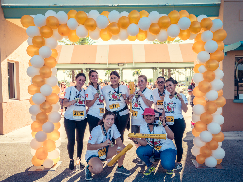 Picture of Petland Pembroke Pines team posing in front of St. Jude Walk/Run entrance.