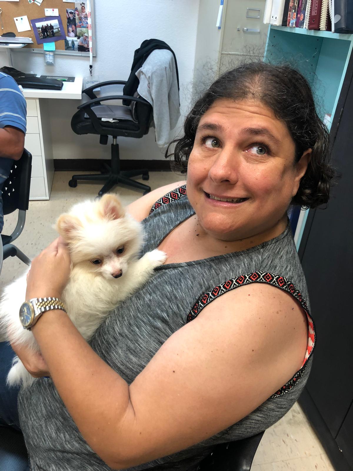 Petland Pembroke Pines picture of WOW Center patient holding a cute Petland puppy.
