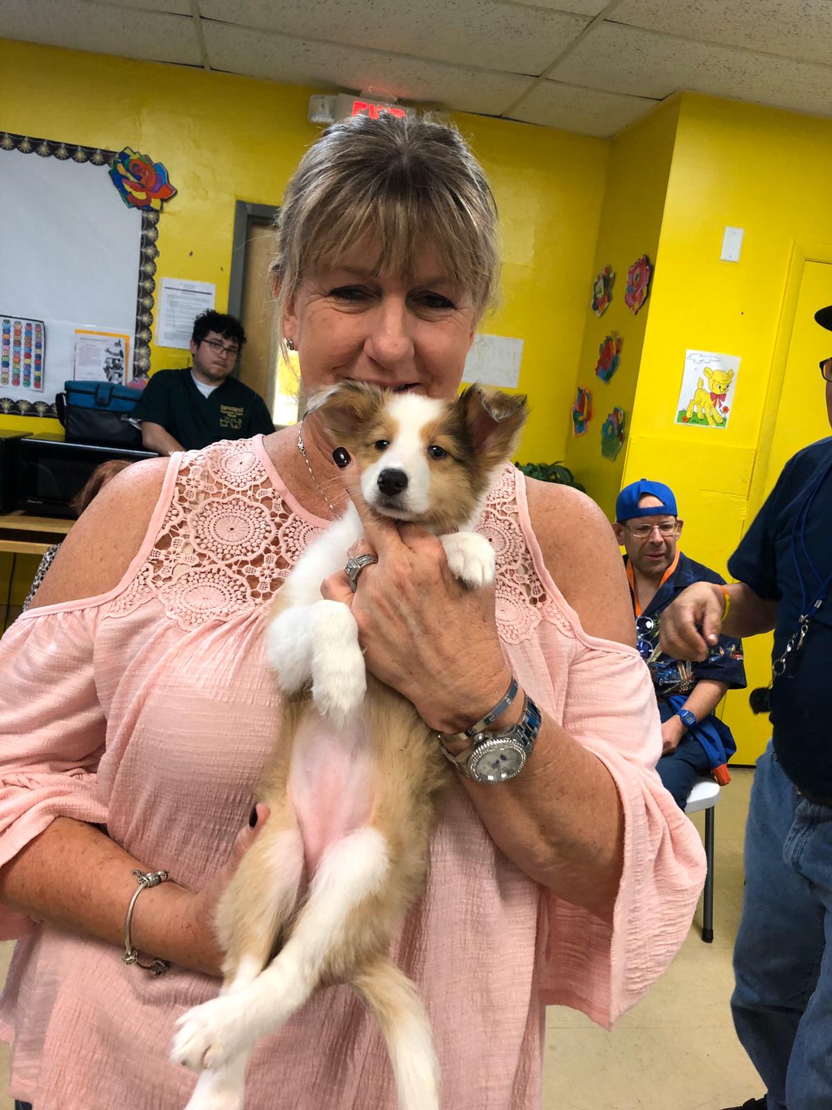 Petland Pembroke Pines picture of a patient from Lucanus Center holding a cute Petland puppy.