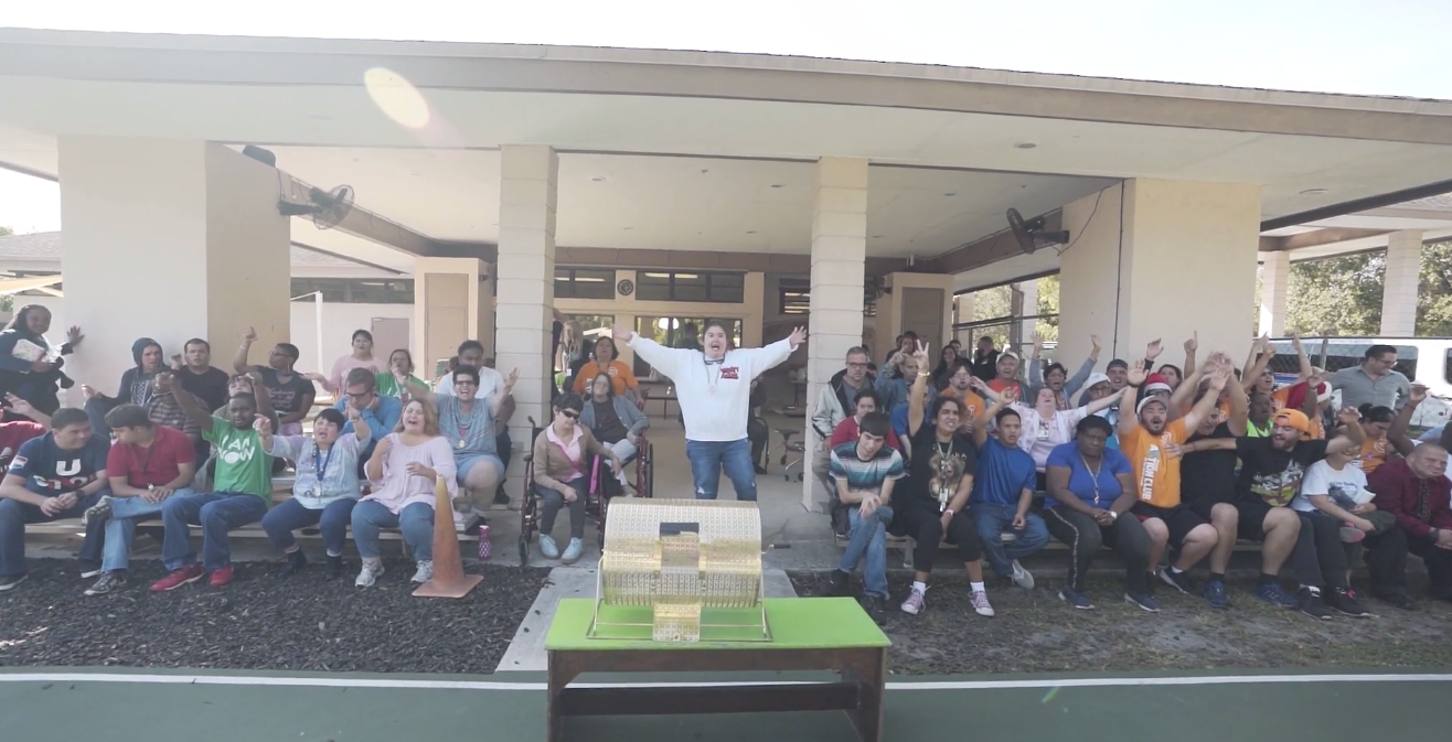 Petland Pembroke Pines picture of WOW Center patients receiving turkey donations from Petland staff.
