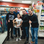 Petland Pembroke Pines picture of Santa Claus, Los Pichy Boys, Luis Marquez and winner of Instagram contest posing with Petland puppy.