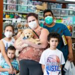 Petland Pembroke Pines picture of Erick Arietta and his family posing with their new puppy.