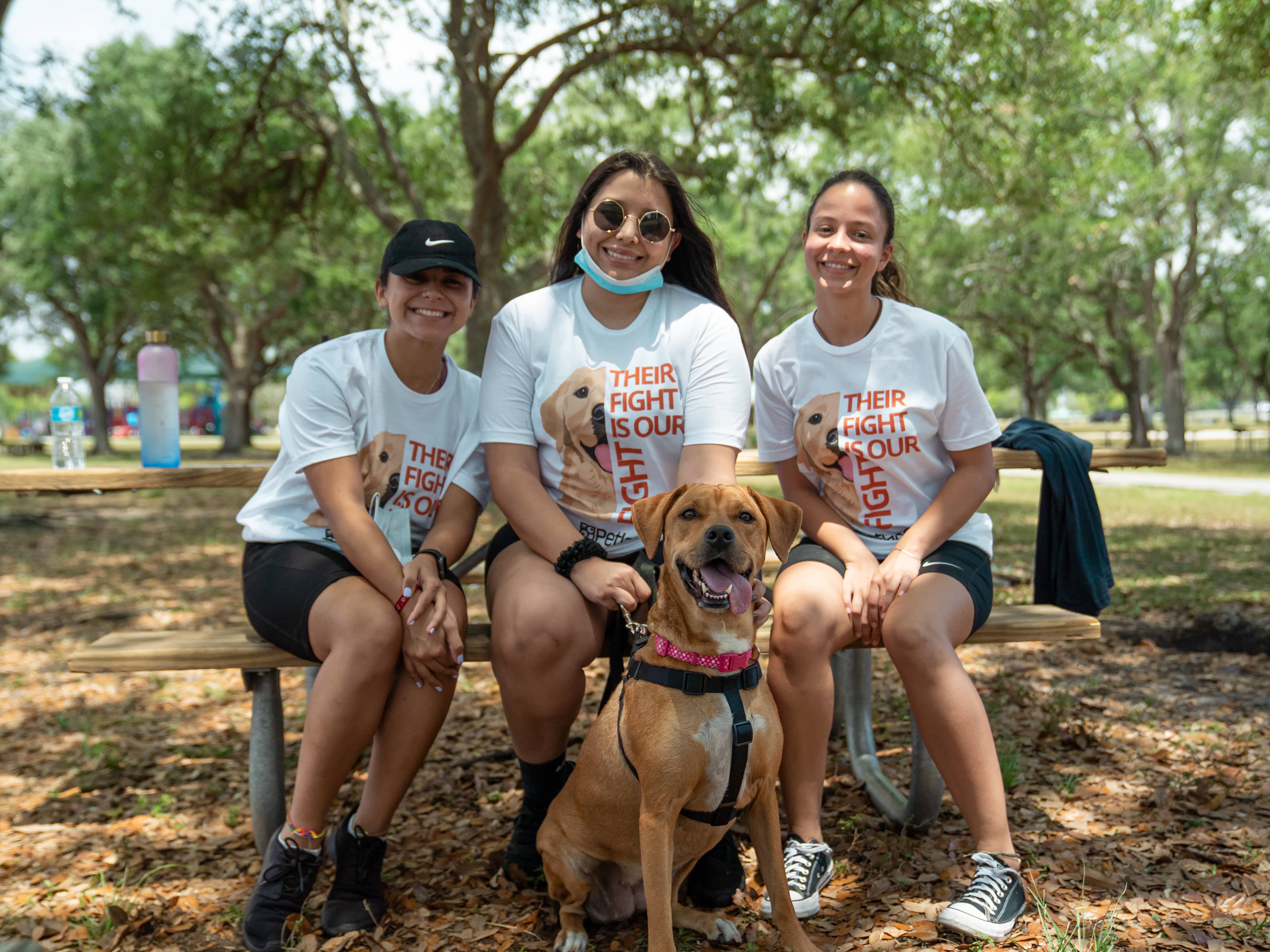 community members and volunteers from Petland Pembroke Pines gathered together with a dog for March for Cancer event.