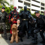 Petland and Miami Power Team volunteers standing together helping with the toy drive.