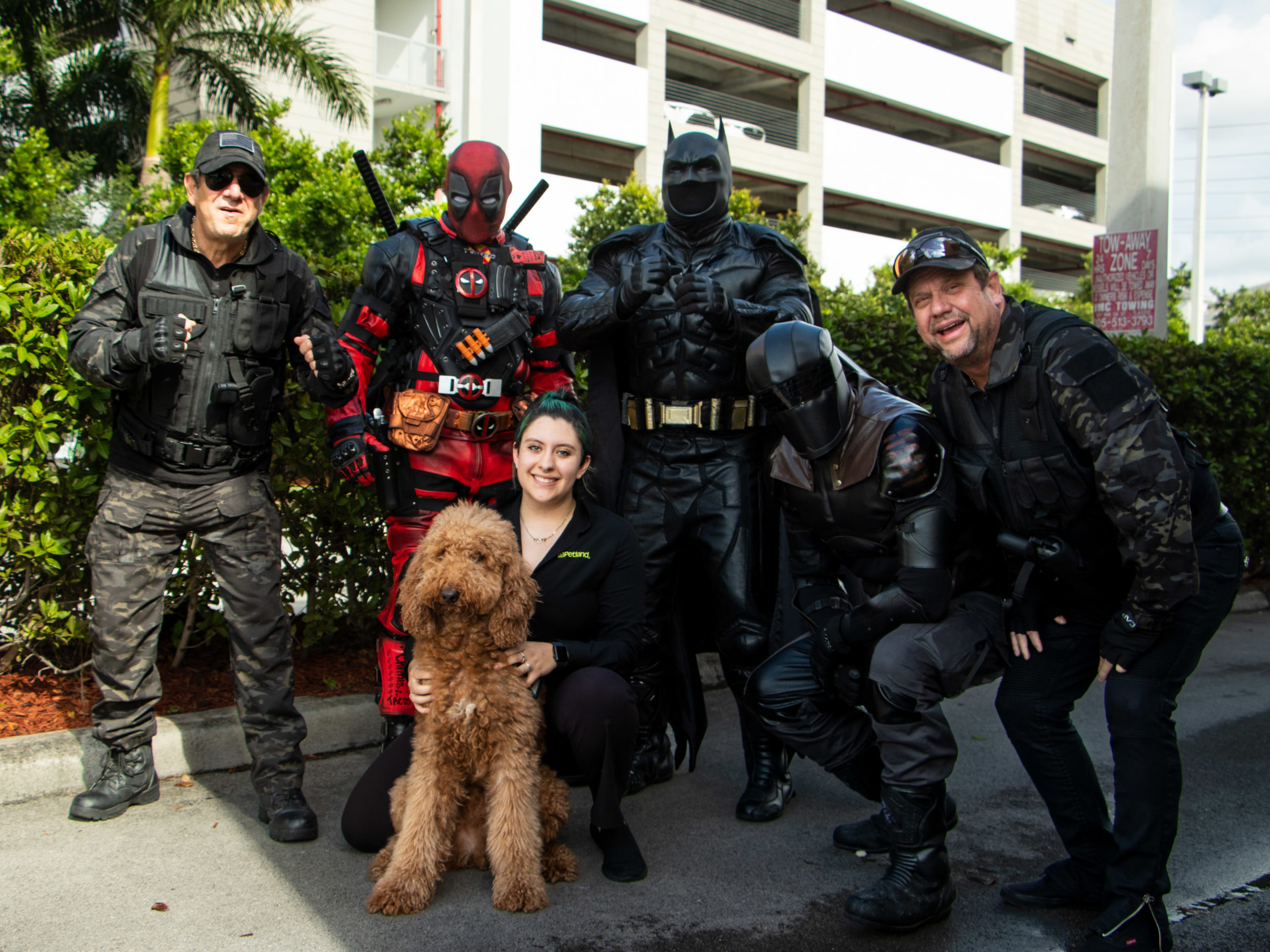 Petland and Miami Power Team volunteers standing together helping with the toy drive.