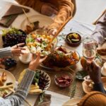 Thanksgiving dinner table full of traditional Thanksgiving dishes.